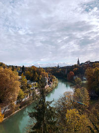 Scenic view of river against sky during autumn