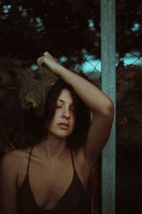 Portrait of woman standing at night