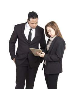 Young woman using mobile phone against white background