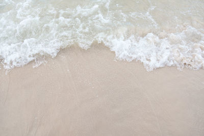 High angle view of surf on beach