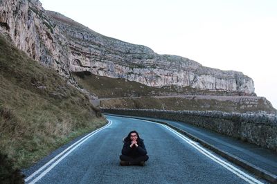 Woman relaxing on mountain