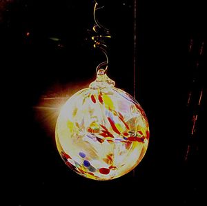 Close-up of illuminated christmas decoration against black background