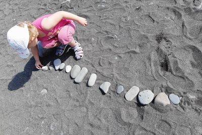 High angle view of girl on sand