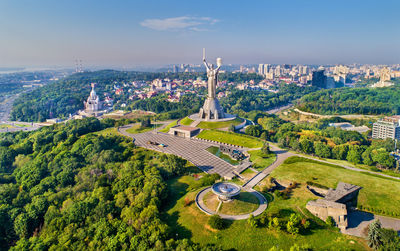 High angle view of trees and buildings against sky