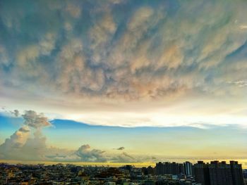 Cityscape against sky during sunset