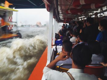 People traveling in boat at chao phraya river