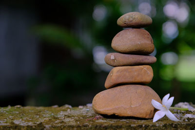 Close-up of stone stack on rock