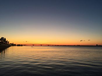 Scenic view of sea against clear sky during sunset