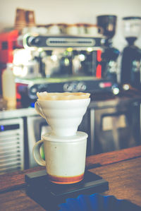 Close-up of coffee served on table at cafe