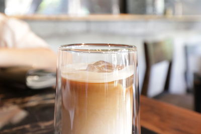 Close-up of coffee in glass on table
