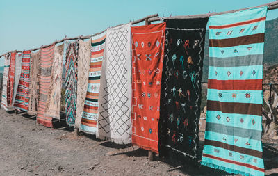 Clothes drying on clothesline against the sky