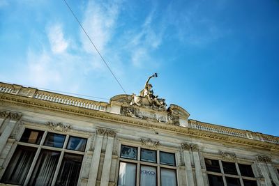 Low angle view of statue against sky