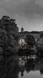 View of buildings and trees against the sky