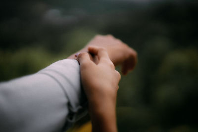 Close-up of hand holding hands