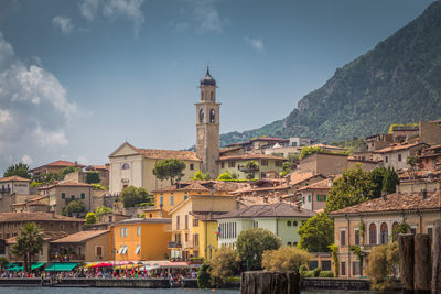 Buildings in town against sky