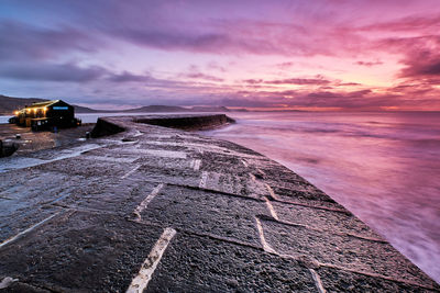 Scenic view of sea against dramatic sky