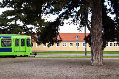 Cars on street with buildings in background