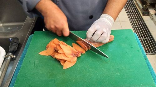 High angle view of person preparing food on table