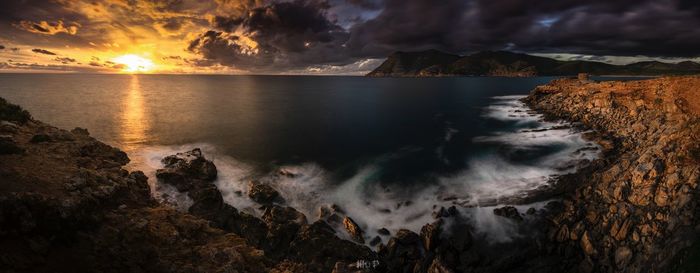 Panoramic view of sea against sky during sunset