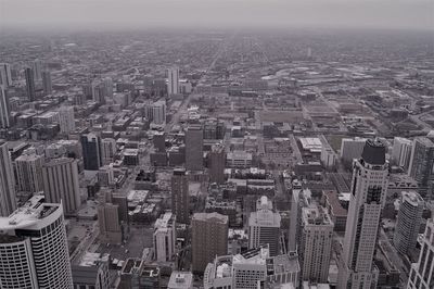 High angle view of modern buildings in city against sky