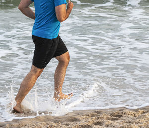 Man running on beach