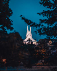 Traditional building against sky at night