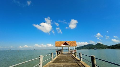 Pier over sea against sky