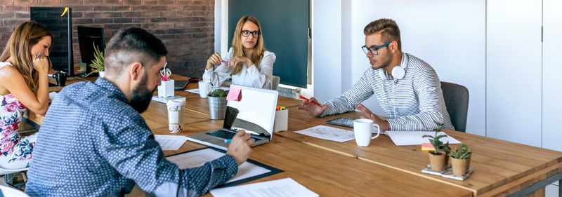 Group of people sitting on table