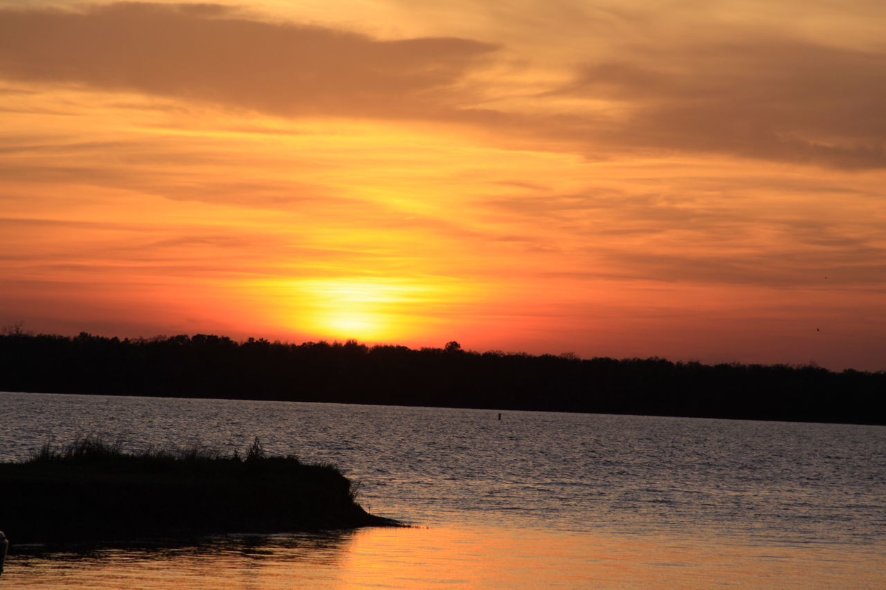 SCENIC VIEW OF SUNSET OVER SEA