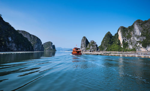 Scenic view of sea against clear blue sky