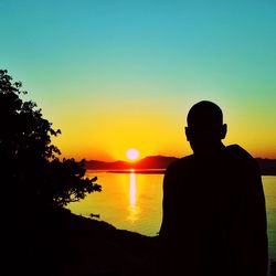 Silhouette of people at sunset