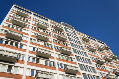 Low angle view of building against clear blue sky