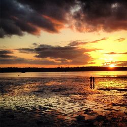 Scenic view of sunset over lake