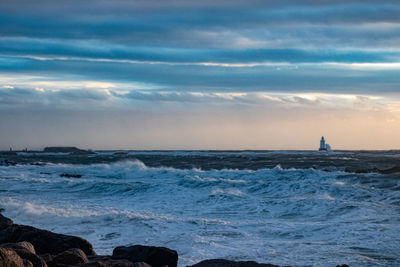 Scenic view of sea against sky during sunset