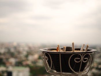 Close-up of drink on table against sky