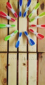 High angle view of colorful clothespins on table