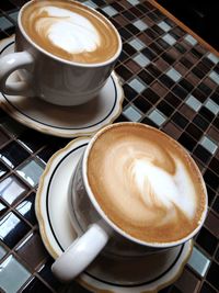 High angle view of cappuccino on table