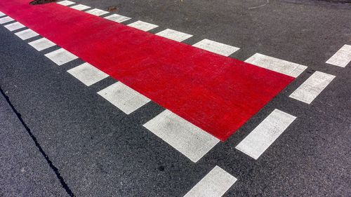High angle view of arrow sign on road in city