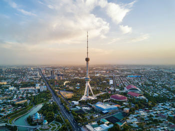 High angle view of city against cloudy sky