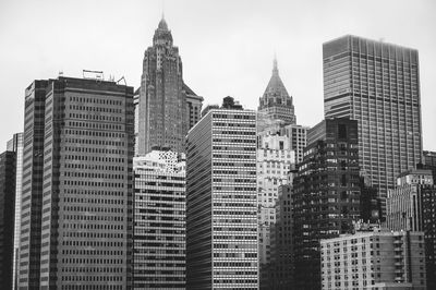 Low angle view of buildings in city against sky