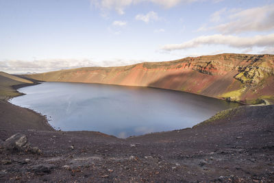 View of lake ljótipollur from top of ridge in landmannalaugar, iceland