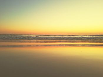 Scenic view of sea against clear sky during sunset