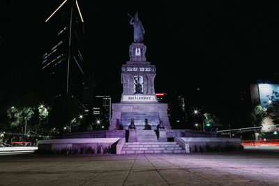 Low angle view of statue at night