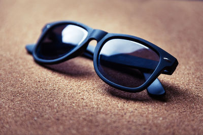 Close-up of sunglasses on floor