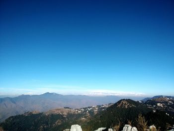 Scenic view of mountains against clear blue sky