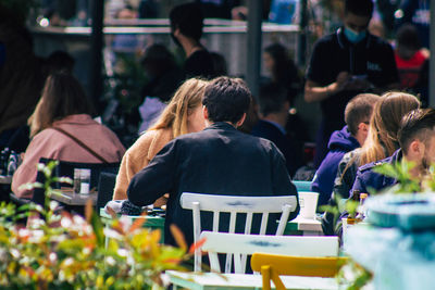 Rear view of people sitting in restaurant