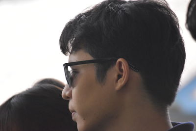 Close-up portrait of young man looking away