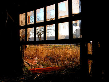 Abandoned building seen through window
