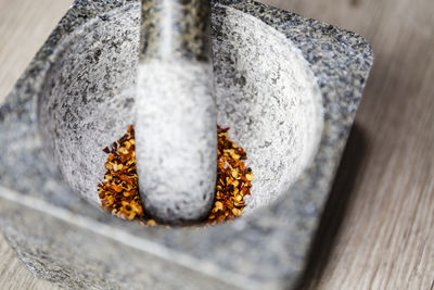 Close-up high angle view of spices in mortar with pestle