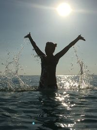 Sun shining over sea